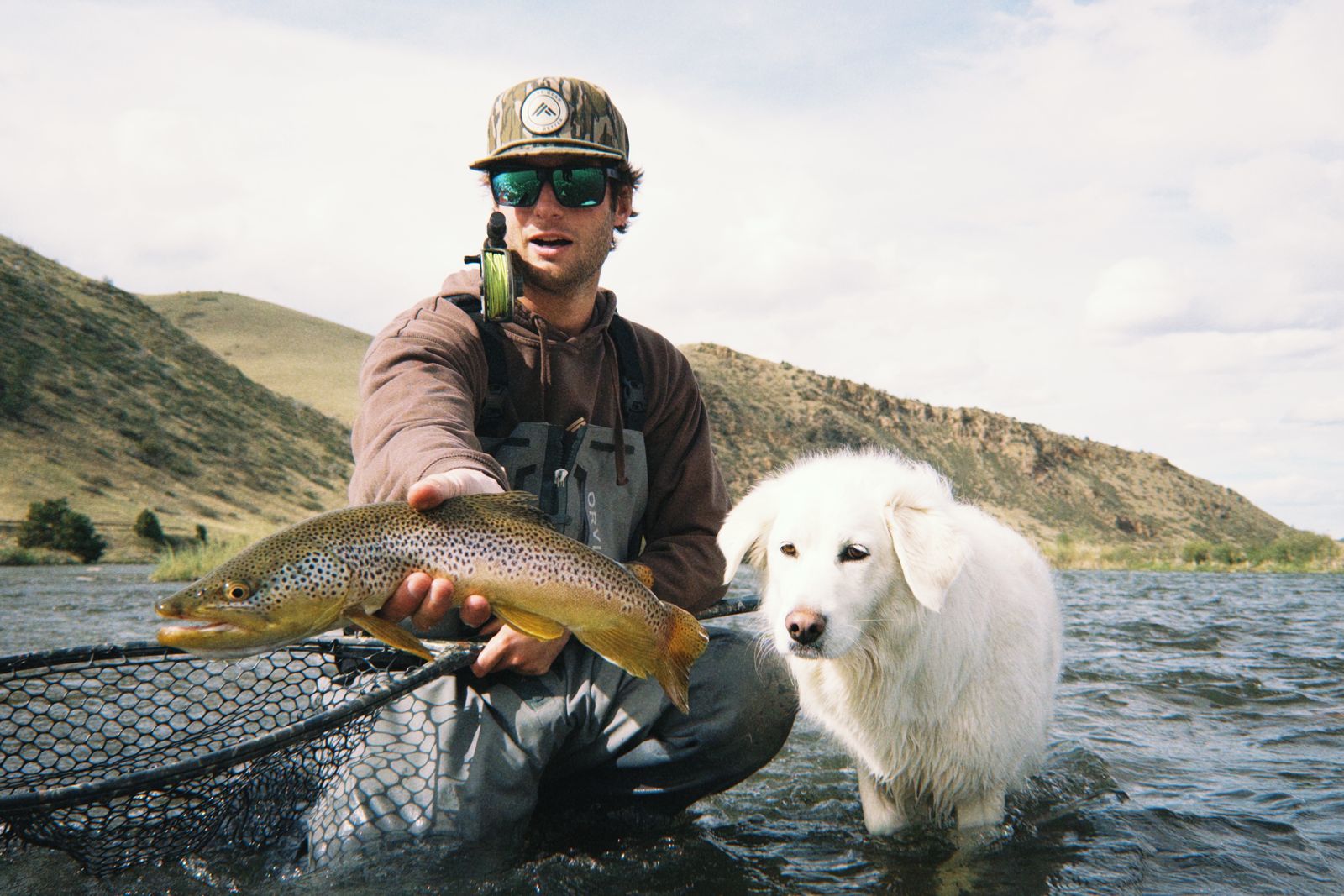 Montana fly fishing — guide with a brown trout